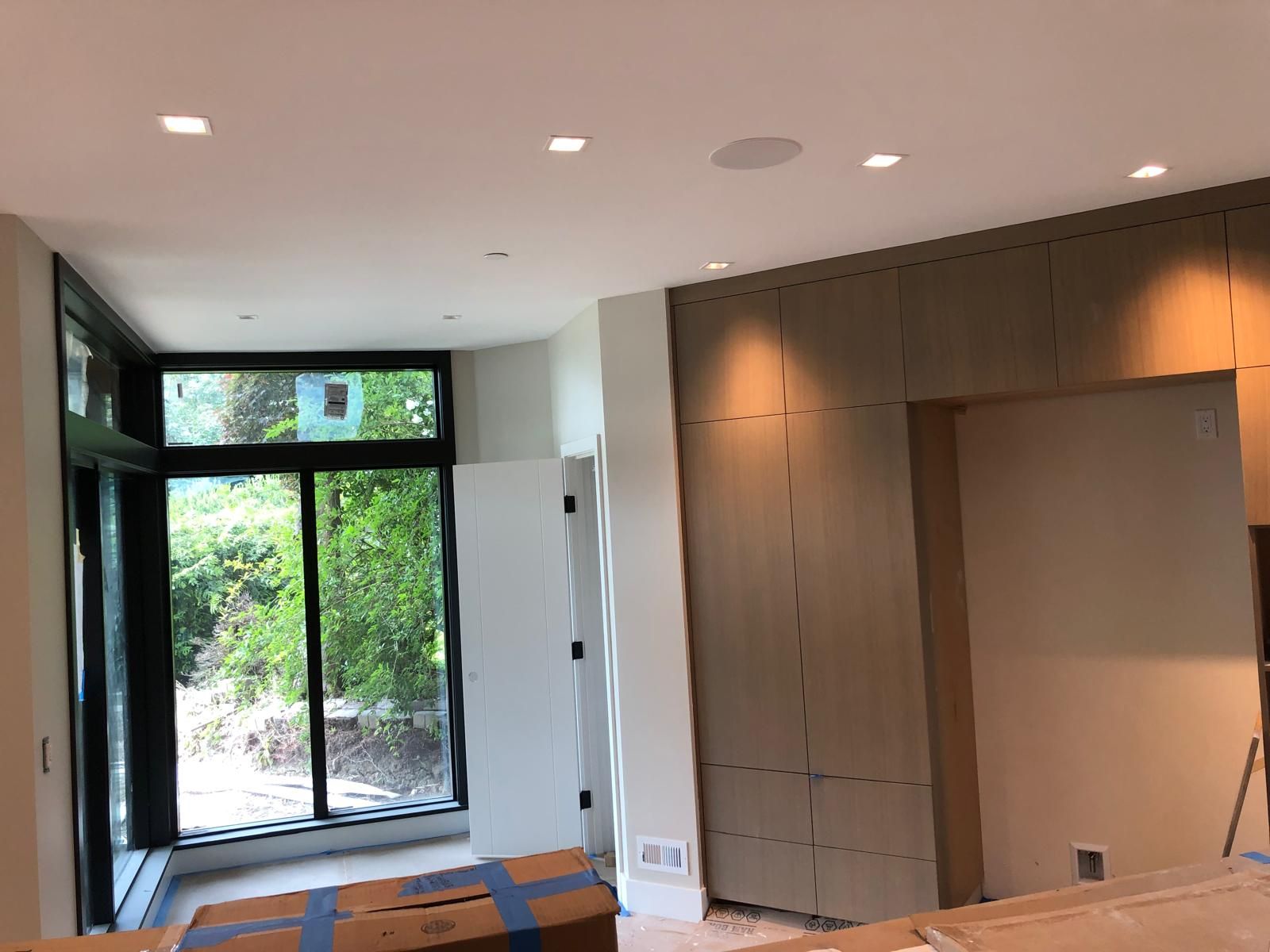 Painted white ceiling and walls beside a wood feature wall