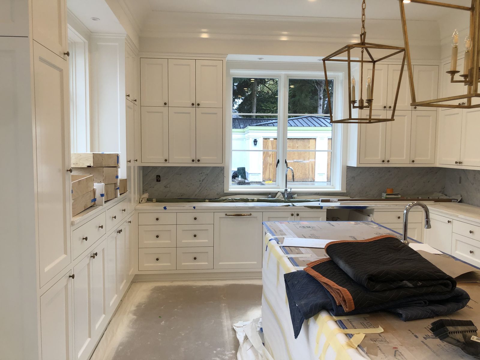 White painted kitchen cabinets with new hardware